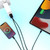 Charging iPhone and iPad using black Lightning to USB-A cables.