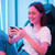 Person using Laser TWS gaming earphones