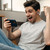 Person enjoying gaming with Laser TWS gaming earphones