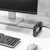 monitor stand in use on desk with keyboard and mouse connected to usb hub side view