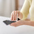 cleaning smartphone screen with soft wipe