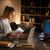 Laser bluetooth turntable on desk beside woman working