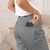 Laser 5000mAh portable charger black with LED indicator in a pant back pocket