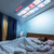 lifestyle image projector showing netflix on bedroom ceiling