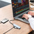 Laser USB-C to 4 Port USB-A Hub on a work table connected to a laptop