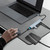 laser usb-c hub connected to laptop in workspace showing practical multi-port desktop use