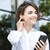 Woman wearing Baseus Bowie WM01 true wireless earbuds in white for everyday listening