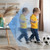 Child playing with a football beside a Baseus P1 Lite camera in a motion tracking scene