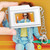child holding Laser blue kids mini digital camera with photo preview