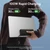Person holding a laptop and black Baseus EnerFill FC41 power bank with its built-in USB-C cables.