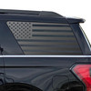 Matte black American flag decal on SUV side window