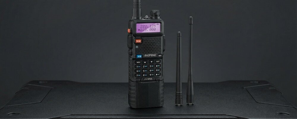 A Baofeng walkie-talkie equipped with an extended high-capacity battery pack for multi-day use.