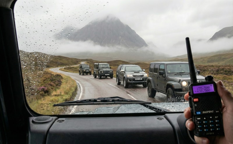 Rugged 4x4 convoy using walkie talkies on a UK road trip in the Scottish Highlands