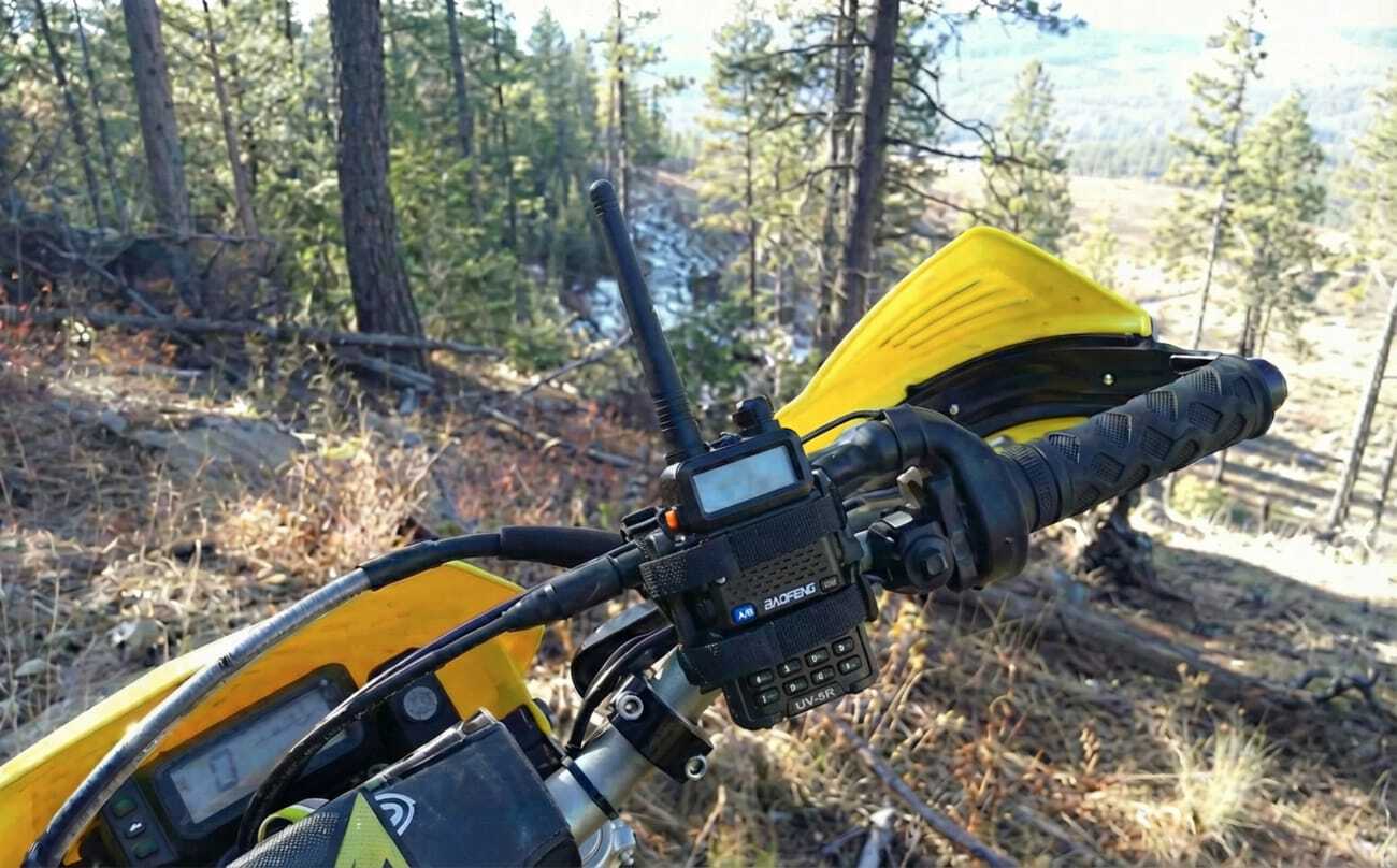 Motorcycle rider using communication system during group ride