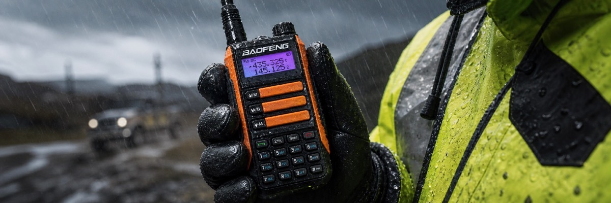 Outdoor workers use a rugged, waterproof long-range walkie-talkie in inclement weather.