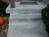 Typical crack repaired with a stiff concrete repair material.  This type of  crack repair will fail at first movement of the concrete step. 