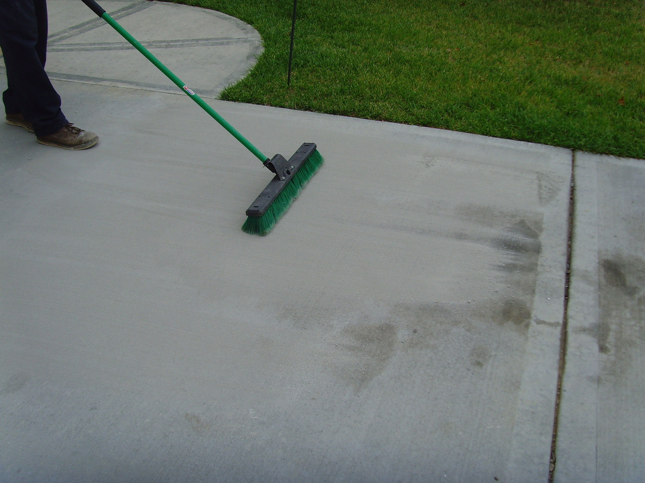 SealGreen Waterless Oil Cleaner is applied dry to the oil stain.