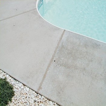 Clean and seal expansion joint on a concrete pool deck