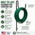 Decorative in-ground hose holder keeps a coiled garden hose neatly organized beside a flower bed.