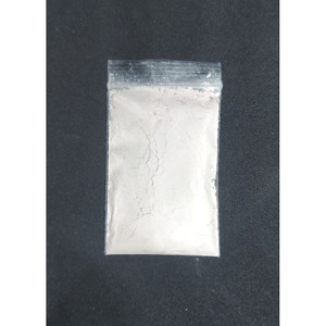 Close-up of small zip-lock packs of organic clay samples for face masks, each labeled with content and weight."