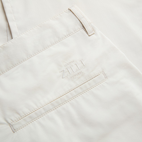 Solid color pale fawn flat-front trousers