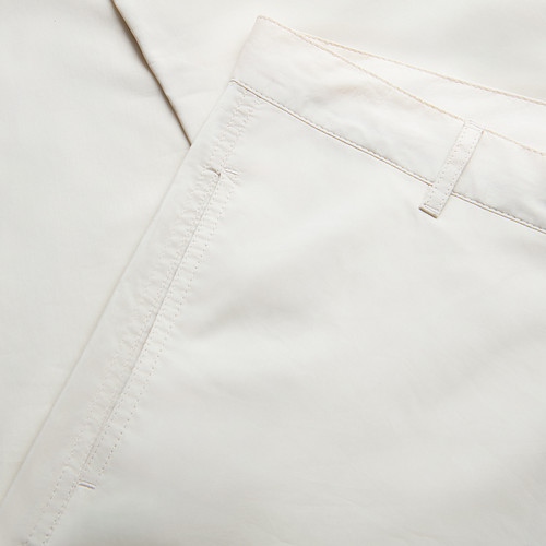 Solid color pale fawn flat-front trousers