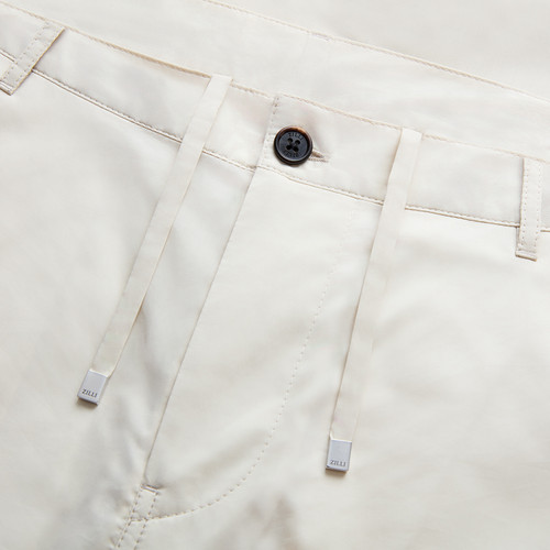 Solid color pale fawn flat-front trousers