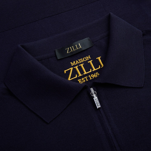 Polo zippé bleu marine, bande latérale en cuir