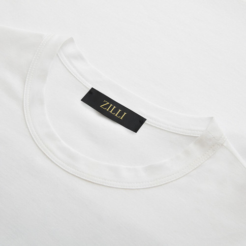 White T-shirt, round neck, “Fantasy” patch on back White T-shirt, round neck, “Fantasy” patch on back