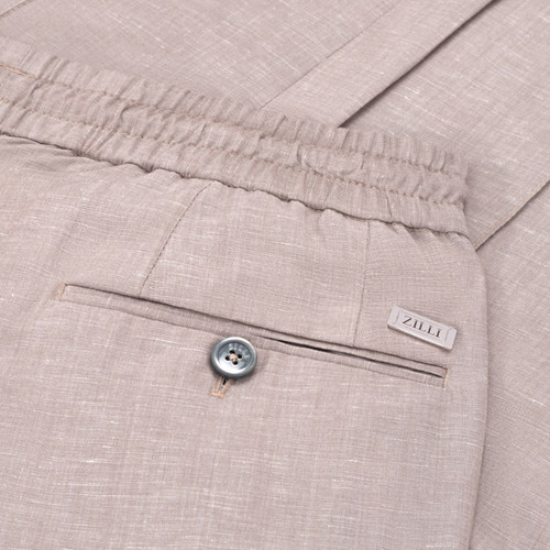 Beige trousers, elasticated waistband and drawstring