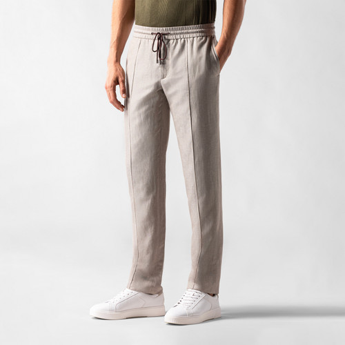 Beige trousers, elasticated waistband and drawstring