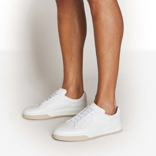 White sneakers with stitching, beige and white sole