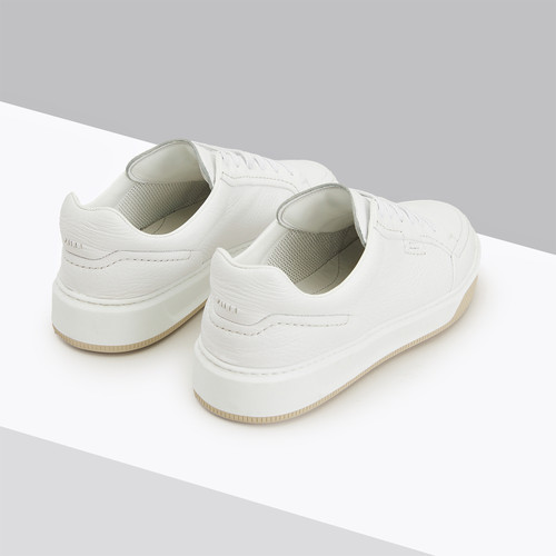 White sneakers with stitching, beige and white sole