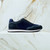 “Hidden Stitched” sneakers in periwinkle blue