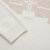 White zipped mock neck sweater, "Staggered Square"
