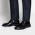 Black derbies, stitching details
