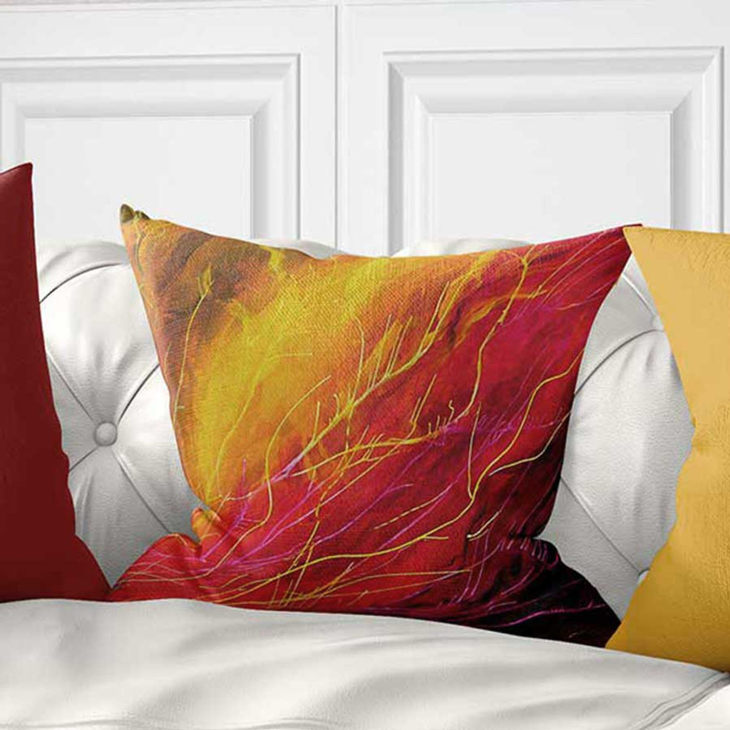 red and yellow throw pillow with art design by Julia Bars