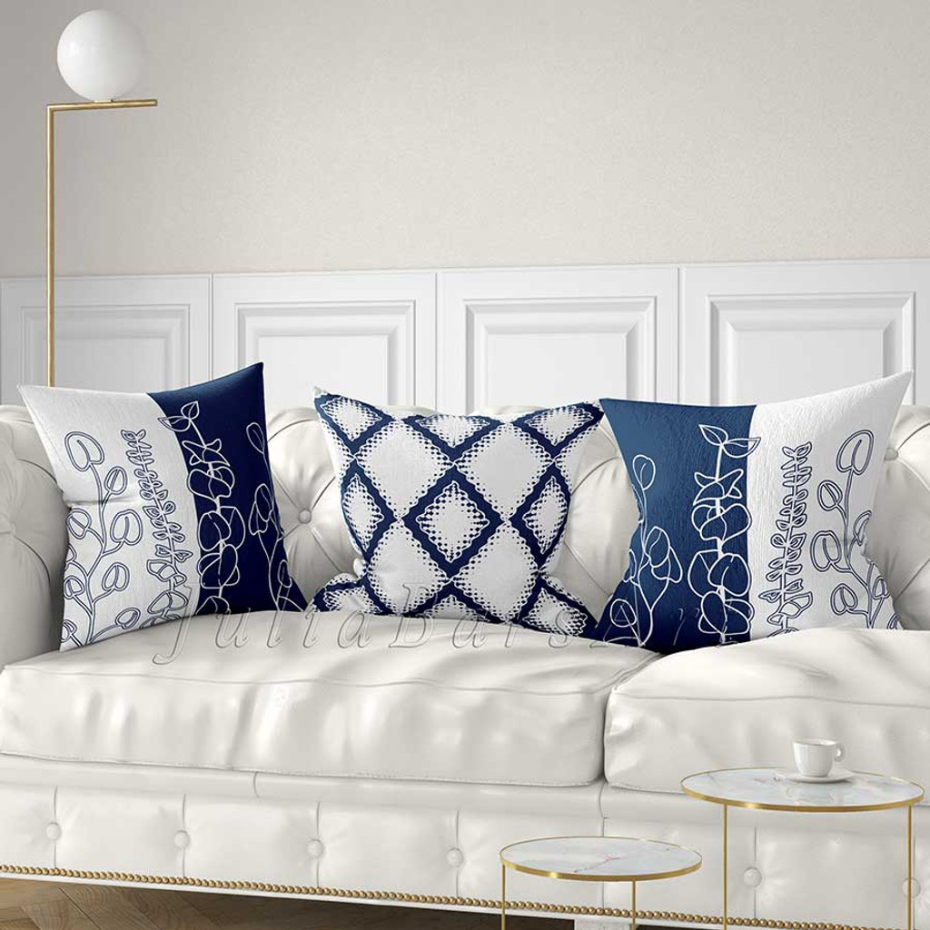 floral and geometric decorative pillows in blue and white