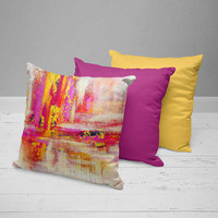 collection of colorful throw pillows with artistic pattern