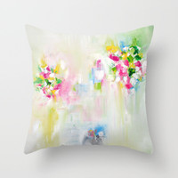 colorful art cushions in white, pink, green and yellow with abstract design