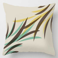 decorative cushion with brown, mint green and yellow leaf pattern