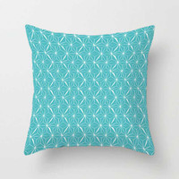 blue and white pillow with geometric pattern