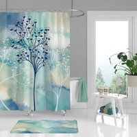 artistic shower curtain with trees in watercolor style in blue, teal and aqua green
