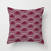 designer pillow with burgundy and white pattern