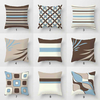 decorative sofa pillows with striped patterns in brown and blue