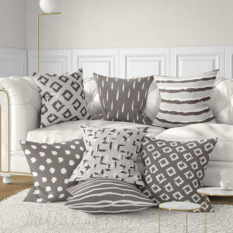 brown, beige and gray throw pillow with geometric design