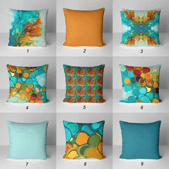 teal and orange outdoor pillows with abstract designs