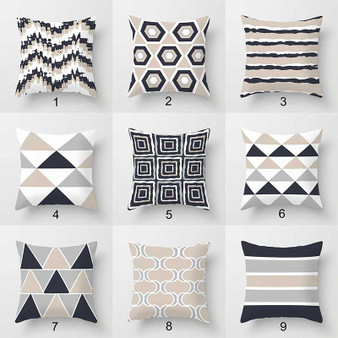 collection of geometric throw pillows in beige, gray and white