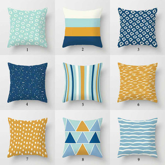 designers collection of dark blue, light blue and yellow pillow covers