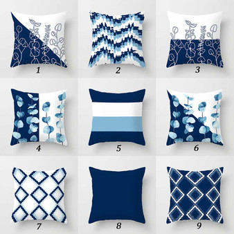 blue and white throw pillows with floral and geometric patterns